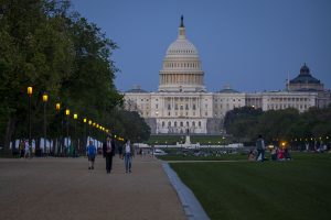 Outdoor lights turn on in front of the U.S. capitol as the sun sets in Washington, D.C., on April 19, 2021. Photo courtesy of Preston Keres/USDA/FPAC.