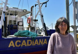 Renowned marine biologist Nancy Rabalais stands in front of the research vessel the Acadiana in Cocodrie, La., Wednesday, March 15. (Lauren Whiddon/WUFT News)