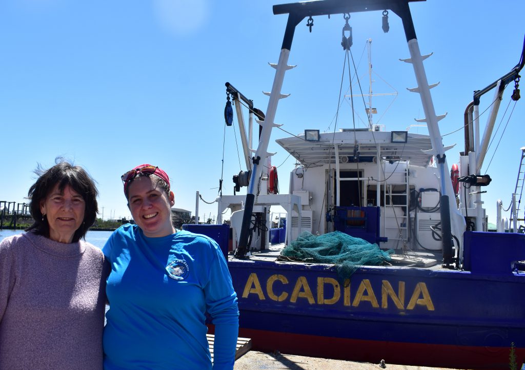 Nancy Rabalais (left) and Cassandra Glaspie (right) pose at LUMCON’s research vessel Acadiana in Cocodrie, La., Wednesday, March 15. (Lauren Whiddon/WUFT)
