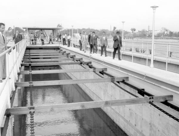 Officials inspect a Jacksonville sewage-treatment plant in the 20 century.