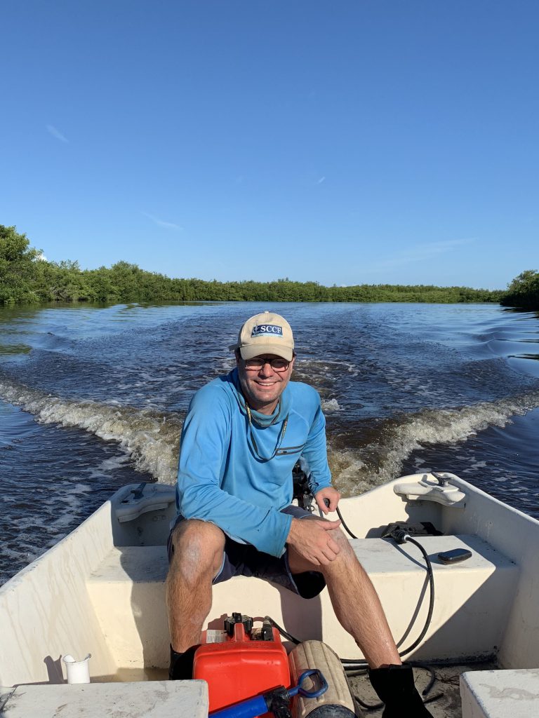 Eric Milbrandt, director of the Sanibel Captiva Conservation Foundation’s marine lab, on a boat.