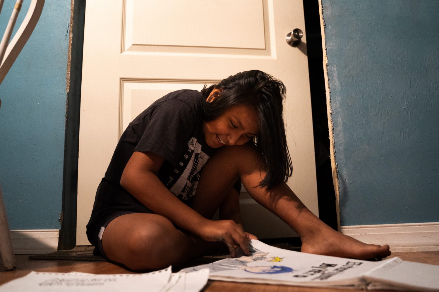 Vanessa looks through some of her recent sketches. She claims that her love for drawing is the reason she has trouble focusing in math class. Vanessa spends her free time filling notebooks with detailed and colorful drawings of her favorite book characters. (Justin Bright/WUFT News)