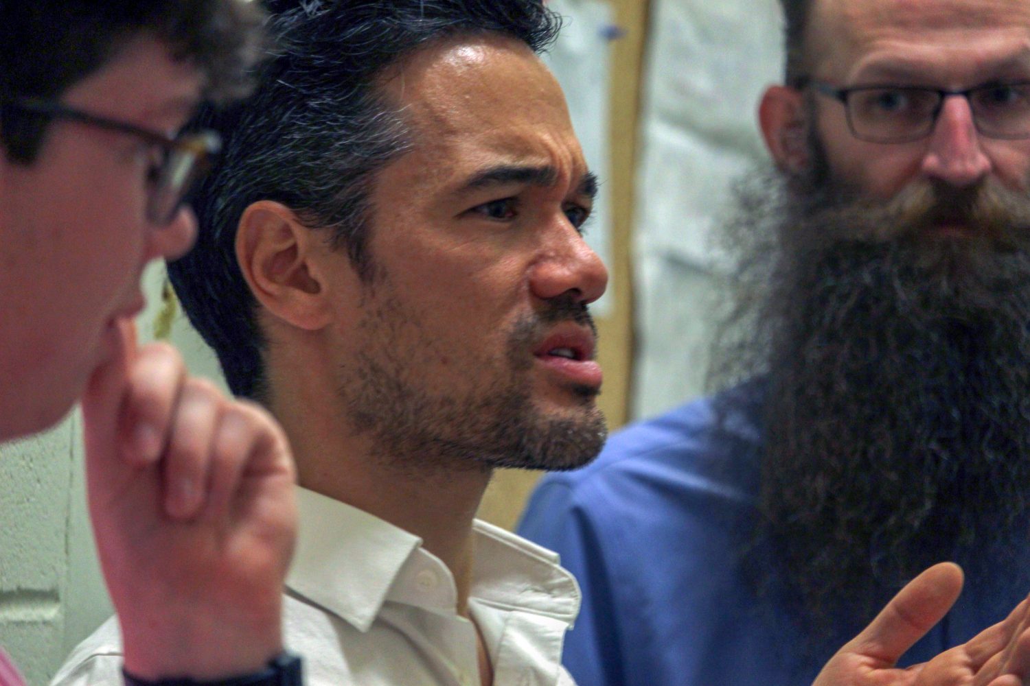 Andrew Cao chats with his colleagues and students minutes before the performance. (Stephanie Strickland/WUFT News)