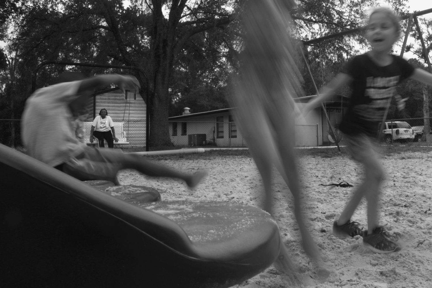 Children play on the playground outside of the Waldo Community Center as Hill supervises them. Many children return each year to Hill’s summer camp. “It’s amazing to watch the kids grow up,” Hill said.