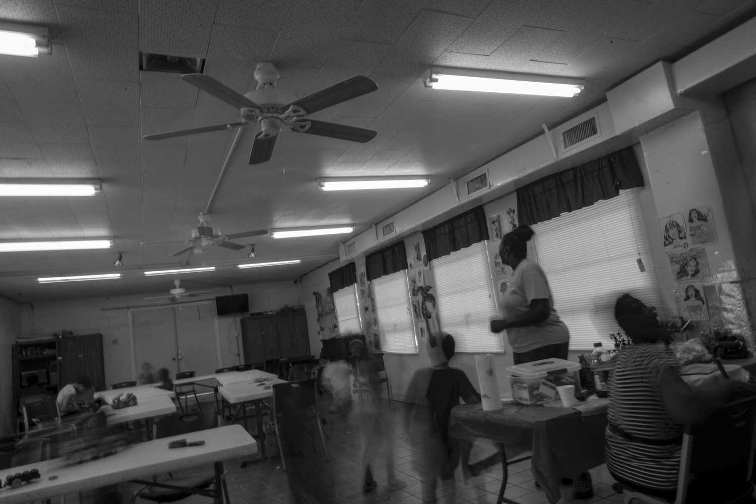 Children play around Hill in the Waldo Community Center. Waldo’s community school closed in 2015, so children are forced to attend school elsewhere. Losing the school also left a social vacuum for the children, which Hill hopes to fill with the Waldo Summer Camp.