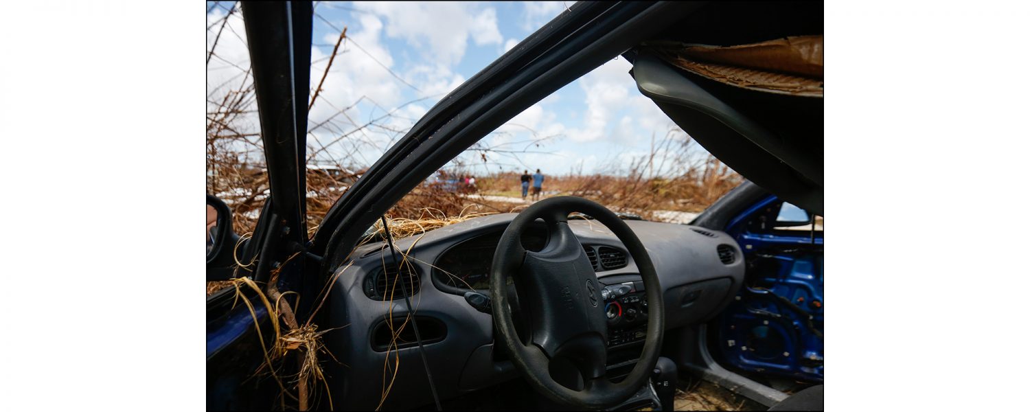 A car destroyed by the high flood water from Hurricane Dorian sits abandoned on the side of the road in High Rock, Grand Bahama on Sept. 16, 2019.