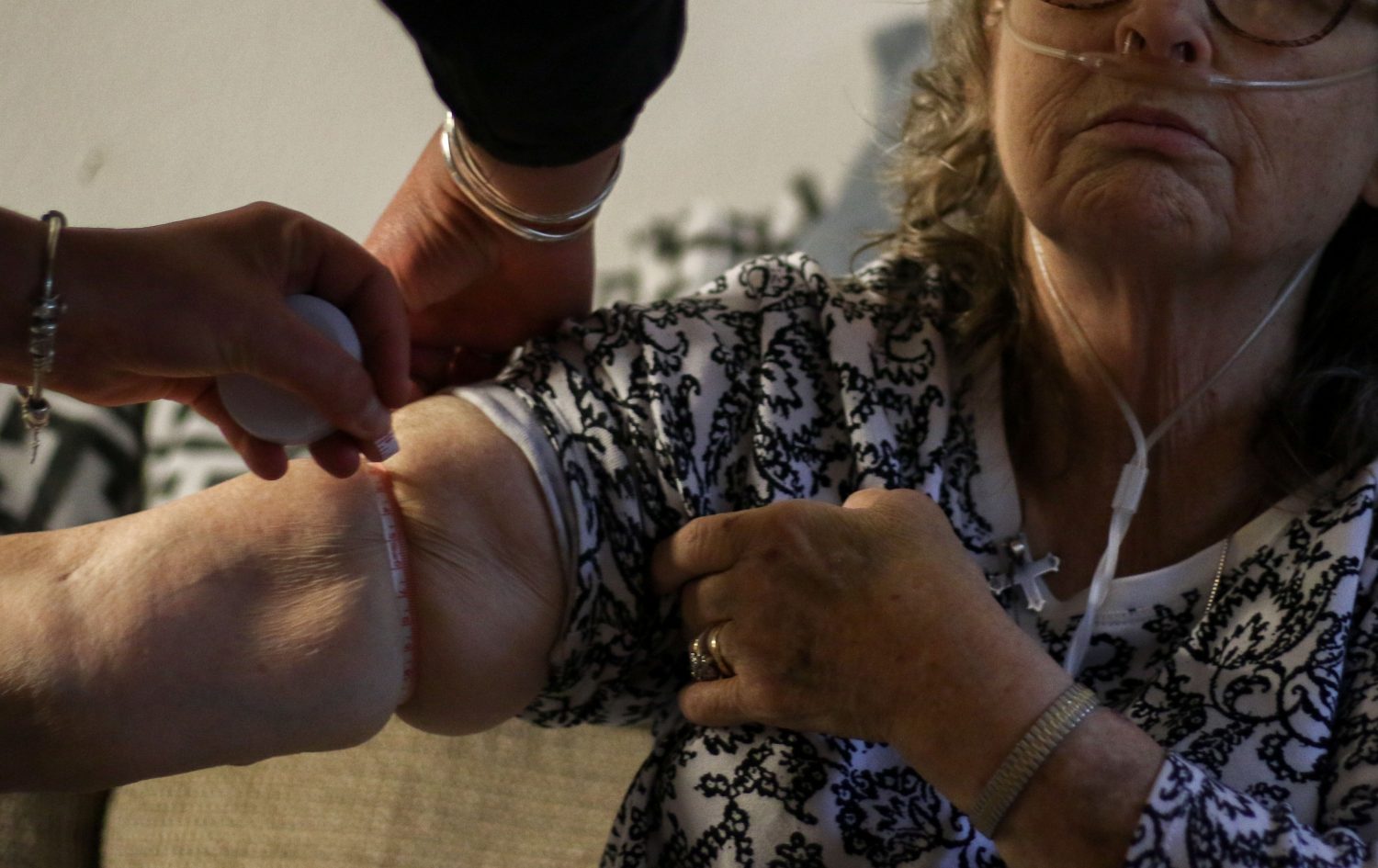Carole receives a check-up from CJ. Patients are viable for hospice care if they have a life expectancy of six months or less. "You're not hastening your death. You're calming it," Carole said about hospice. "And you're not hastening your family's anxiety."