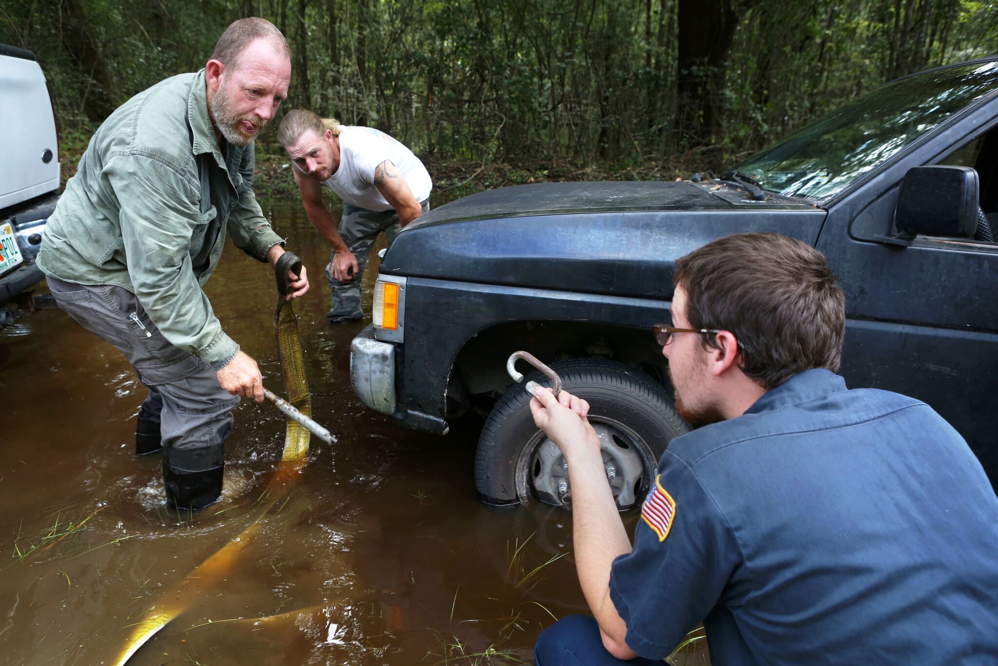 Bradford County had severe flooding after the storm. These are images gathered by Emma Green, which demonstrate how much of the area was flooding post-Irma. In the above picture, Justin Daugherty, right, offers his neighbor Bruce Hines, far left, a metal piece to attach to his truck after it got stuck in the flooded New River in Bradford County while he was trying to put his boat in the water on Sept. 13, 2017.