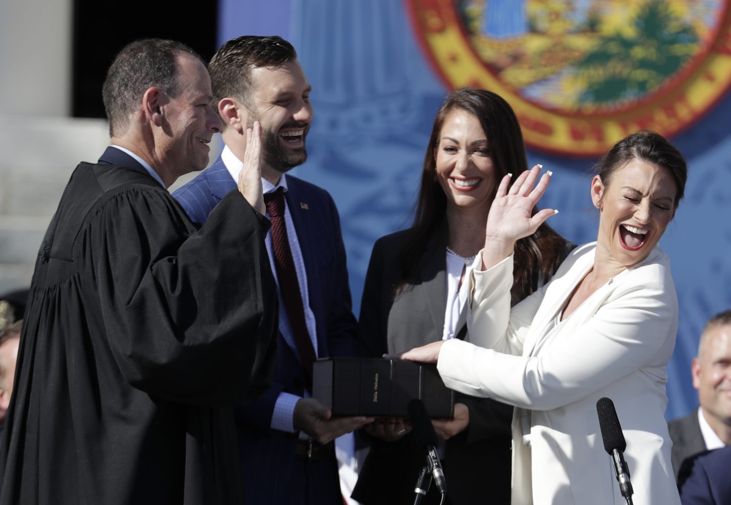 Nikki Fried, right, reacts as she is sworn in as Florida Commissioner of Agriculture by Judge Kevin Emas, left, during an inauguration ceremony, Tuesday, Jan. 8, 2019, in Tallahassee, Fla. (AP Photo/Lynne Sladky)