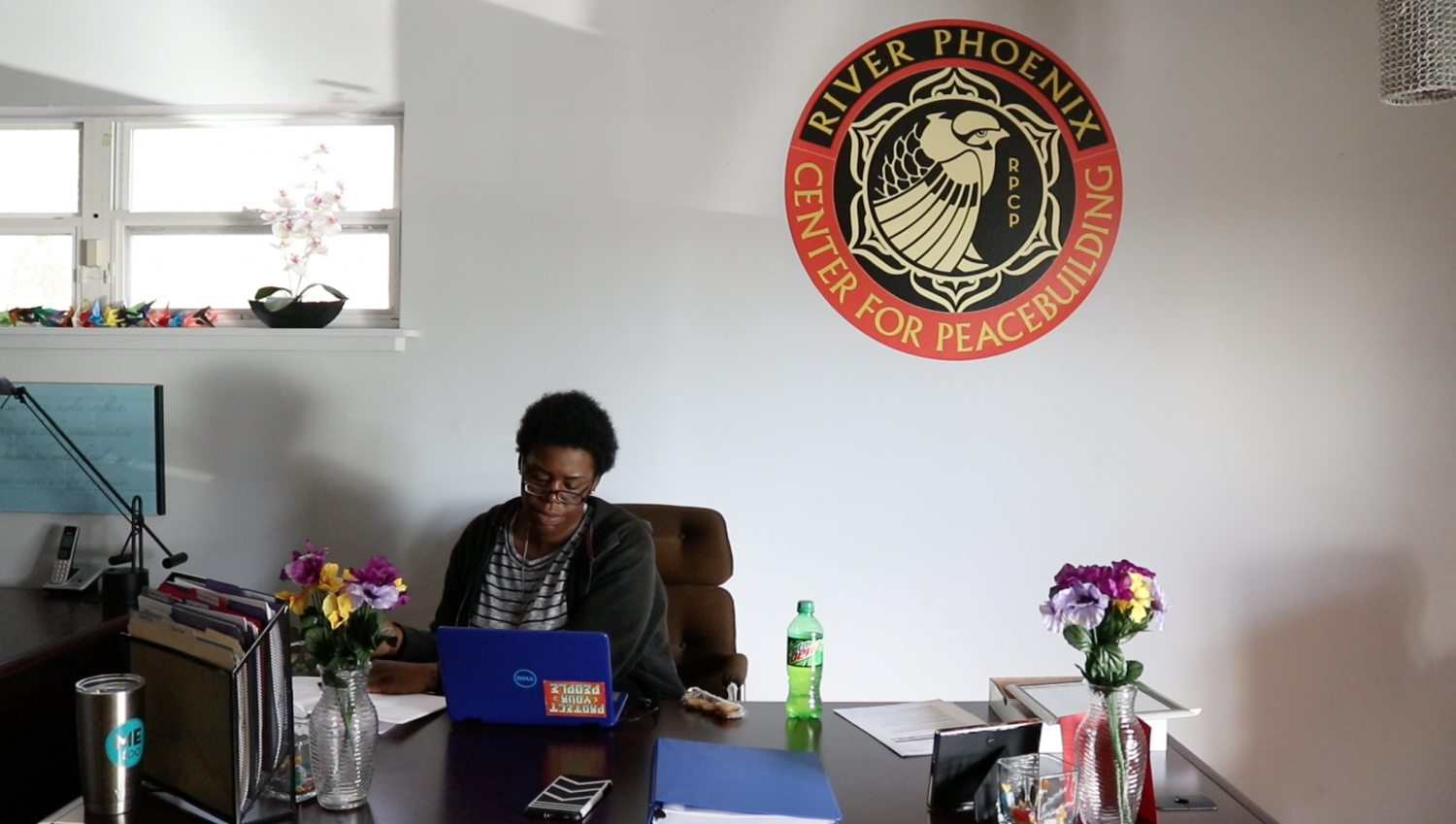 Jhody works at her new job at the River Phoenix Center for Peacebuilding in Gainesville. Life is still filled with obstacles, but she is excited to be working to help other people who have faced the same struggles she has.