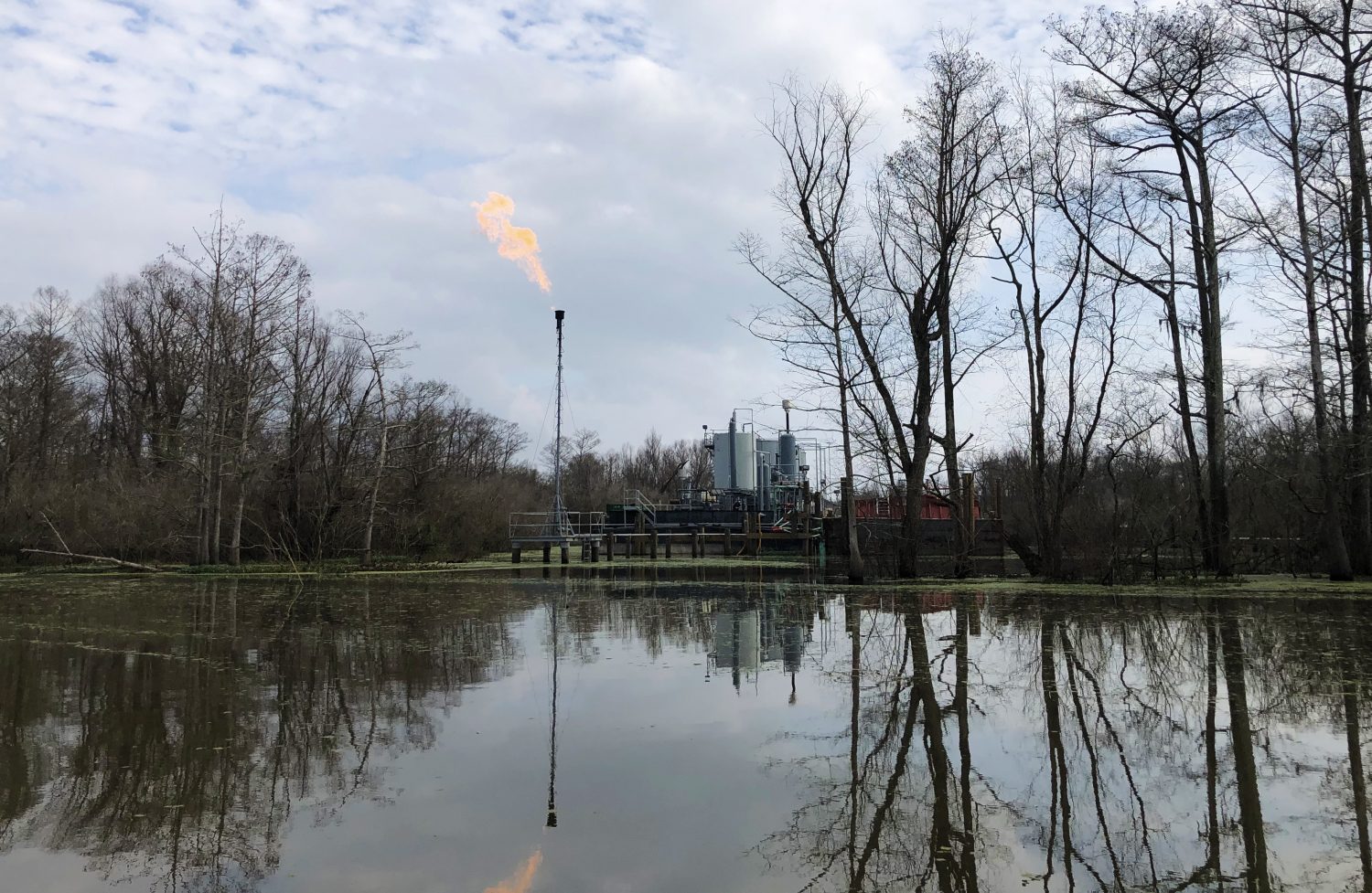 A flame burns above a oil and gas structure in the Atchafalaya Basin. (Photo/Grace King)