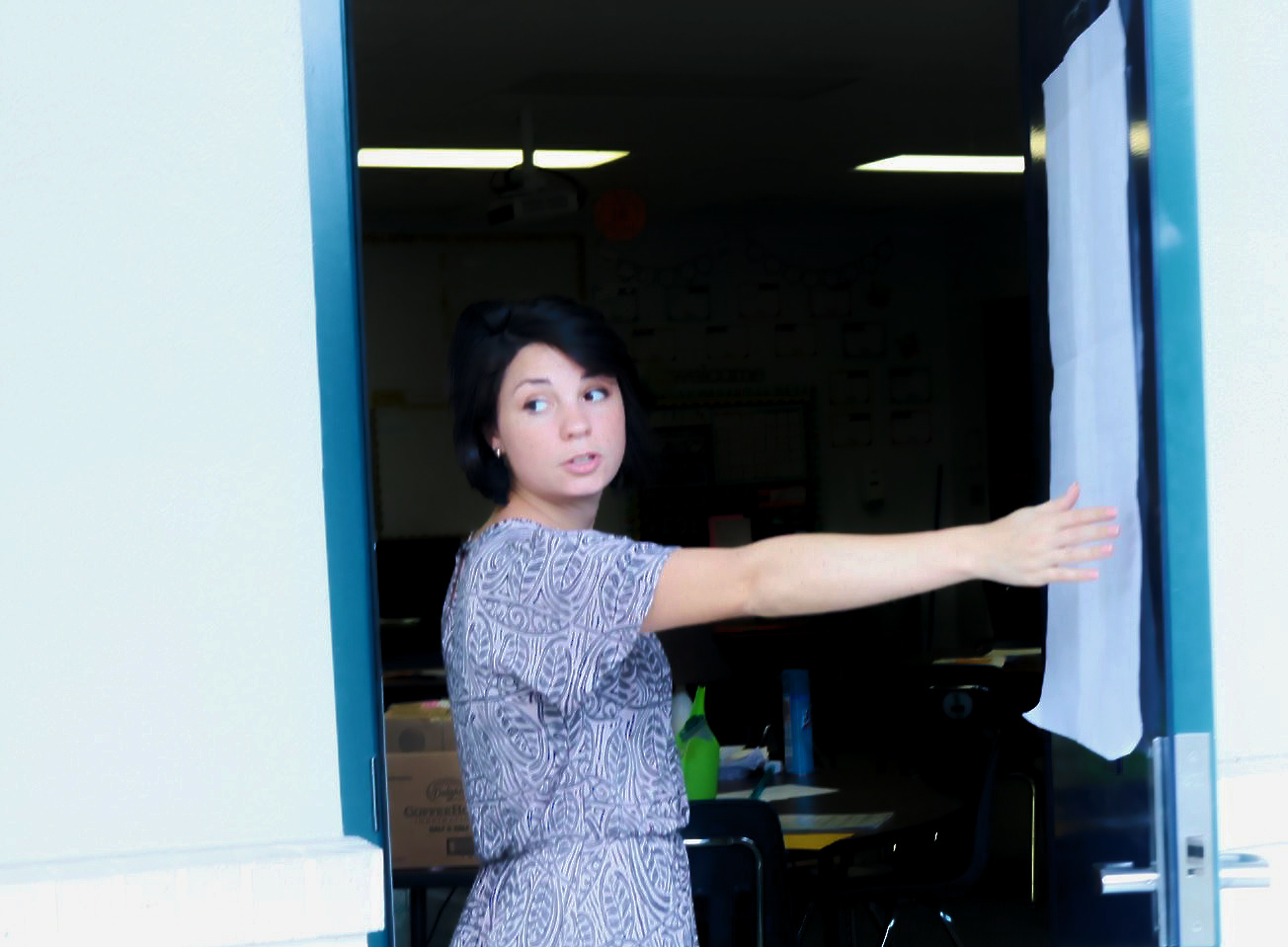Peebles heads into the classroom, keeping a watchful eye on her students.