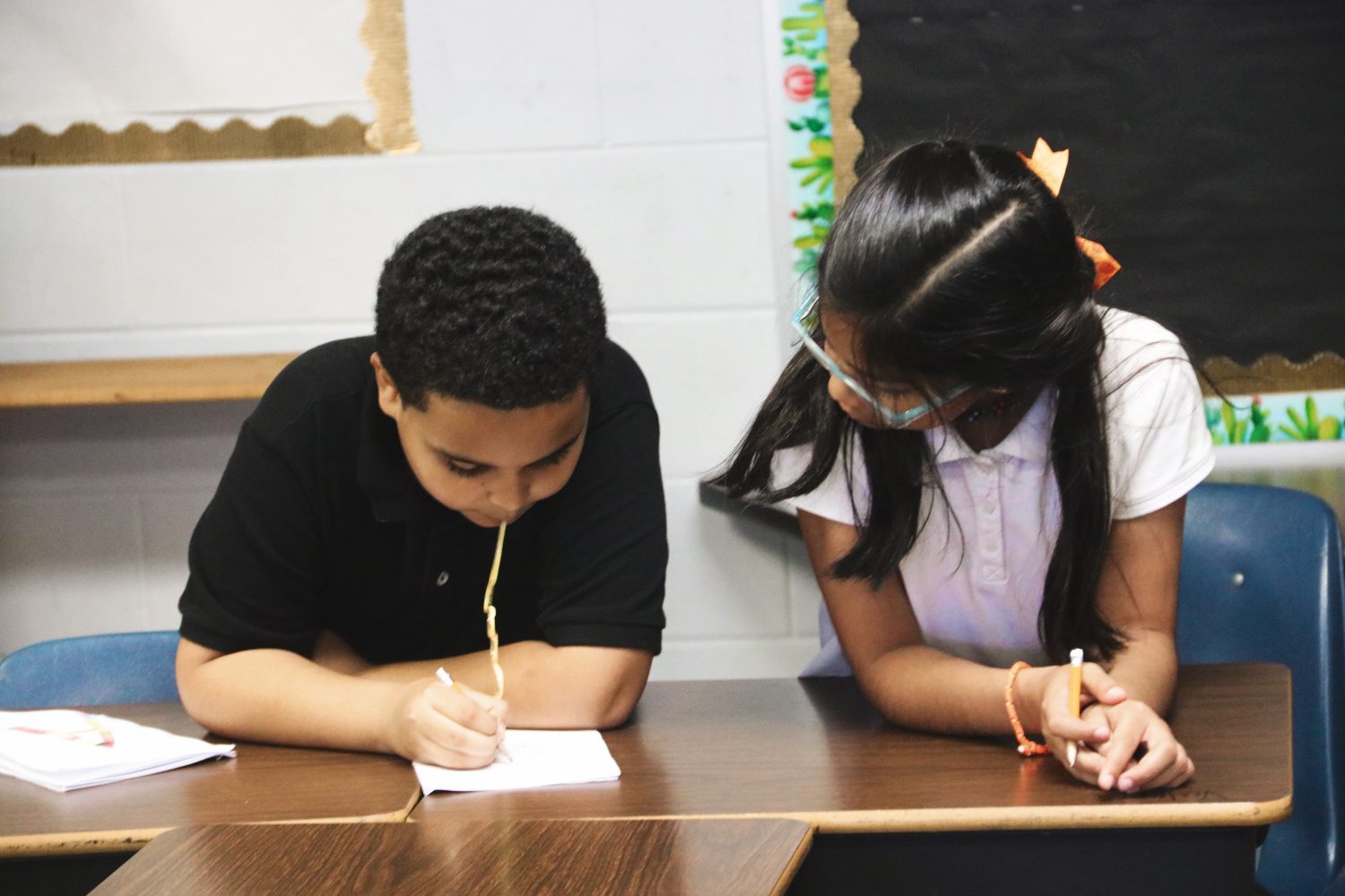 Oakcrest students Yariel and Valeria work together to learn teamwork and social skills along with the curriculum.